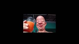 Bald man drinking orange juice shorts [upl. by Pauwles]