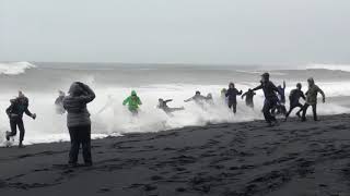 Waves Sneak Up Reynisfjara Beach in Iceland and Knock Over Tourists [upl. by Adall]