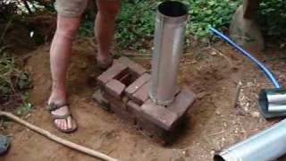 greenhouse construction  rocket mass heater how to tutorial [upl. by Ardnac]