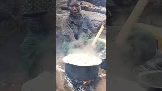 Hadzabe tribe woman cooking lunch [upl. by Klina]