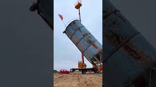 The process of dismantling a vertical cement mixer using a crane [upl. by Atteram]