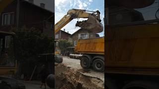 Excavator loading dump truck [upl. by Kamerman]