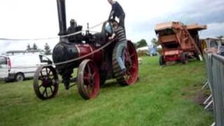 Fitting a belt between a traction engine and a threshing machine [upl. by Avis]