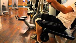 Technogym Seated Leg Curl Machine  GymCalccom [upl. by Nahama707]