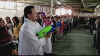 Mexican priest uses watergun to spray holy water [upl. by Elades]