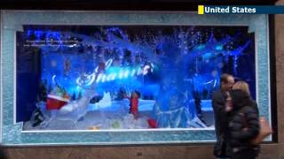 New York stores unveil Christmas 2013 windows NYC retailers get creative with holiday display [upl. by Rovelli799]