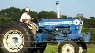 Ford 7000 tractor baling hay [upl. by Ammeg]