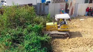 Land filling 12x50m is processing Mini dozers push soil rock filling forest to build a house [upl. by Airednaxela]