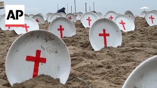 Empty plates on Copacabana beach in Rio highlight plight of worlds hungry [upl. by Yarvis]