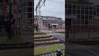 Footpath Level crossing barriers going down at Oss station [upl. by Vandyke]