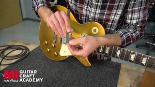 Adjusting a TuneoMatic Bridge – Guitar Setup and Maintenance [upl. by Dailey987]