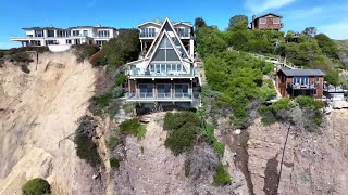 Massive landslide on coastal bluff leaves Southern California mansion on the edge of a cliff [upl. by Rma709]