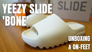 RESTOCKING FRIDAY Yeezy Slide Bone Unboxing OnFeet Sizing amp Review [upl. by Anitnerolf]