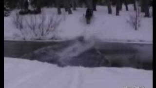 Snowmobiler Cruises Across River and Hits tree [upl. by Wakeen658]