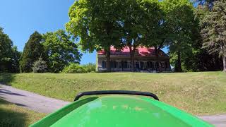 John Deere X584 mowing on a hill 06062018 [upl. by Sedgewake951]