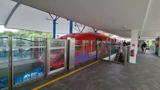 Arrival Platform Sentosa Express Hitachi Smalltype Monorail Red departing Beach station [upl. by Falkner]