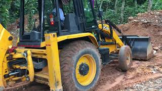 jcb 3dx transporting soil and levelling land [upl. by Asyram]