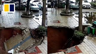 Deep sinkhole forms after pavement in China collapses [upl. by Odey670]