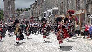 Chieftain leads the massed pipe bands parade through Dufftown to the 2022 Dufftown Highland Games [upl. by Semmes]