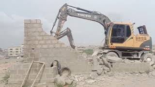 Demolishing wall demolition wall by excavator automobileroadmachinery construction bulldozer [upl. by Lenroc]