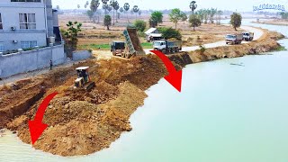 A group of 25ton trucks poured stones into the water to prevent landslides [upl. by Hakceber]