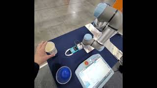 A torque sensorless gripper distinguishes between iced and hot Americano cups at Robot World 24 [upl. by Malvia]