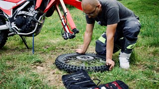 CHANGE A MOTORCYCLE TIRE WHILE TRAVELLING [upl. by Ueihtam820]