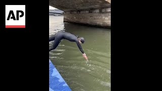 French minister takes plunge into Seine river ahead of Paris 2024 Olympics [upl. by Sopher202]