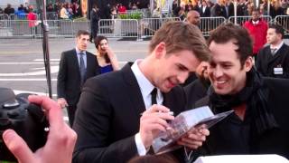 Liam Hemsworth Miley Cyruss boyfriend swarmed by fans at The Hunger Games Premiere [upl. by Aramanta]