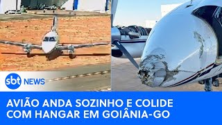 Avião anda sozinho e colide com hangar em Goiânia veja o vídeo  SBT News [upl. by Dadinirt]