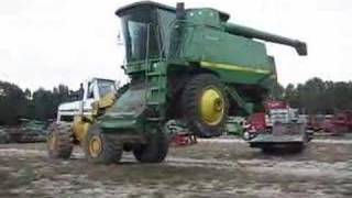 Unloading A 125 Ton 9610 John Deere Combine with Hough 560 [upl. by Cleodal985]