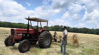 Raking Hay  Fort Knoxagriculture farmingallischalmers tractor tractorvideo hay [upl. by Torres]