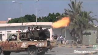 Libya conflict rebels fight their way into Col Gaddafis compound [upl. by Orimar]