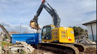 Excavator Loading Demolition Garbage Into Dumpsters [upl. by Ailaza]