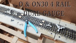 Hand laying O standard gauge and ON30 narrow gauge track in a dual track arrangement [upl. by Warder]