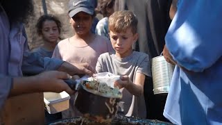 Displaced people in Gaza struggle with food shortages [upl. by Airetak]