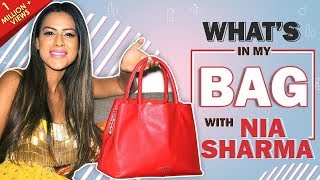 What’s In My Bag With Nia Sharma  Bag Secrets Revealed  India Forums [upl. by Leeke]