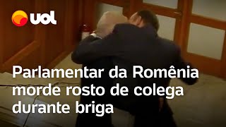 Político morde rosto de colega durante briga na Romênia veja vídeo [upl. by Eloisa217]