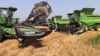 8 John Deere S690 Combines Getting Ready to Cut Wheat [upl. by Lagas]