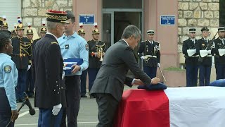 Le gendarme Eric Comyn fait chevalier de la Légion dhonneur lors de lhommage à Nice  AFP Images [upl. by Eelyk]