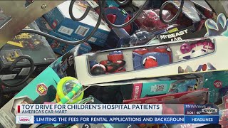 Americas Car Mart hosts toy drive for Childrens Hospital patients [upl. by Balmuth]