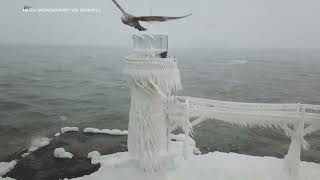 Historic lighthouses encased in ice on the shores of Lake Michigan [upl. by Alegre]