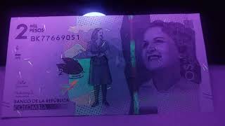 Chromophores 2000 Colombian Pesos Banknote 2018 Uncirculated under ultraviolet light [upl. by Ennylhsa958]