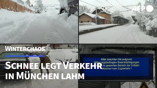 Heftiger Schneefall legt Bahn und Flugverkehr in München lahm  AFP [upl. by Tap]